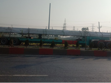 19.8 meter pipe transportation using special low-bed trailer. 